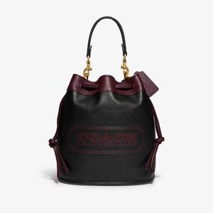 Mini coach bucket bag